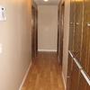 Hallway after popcorn ceiling texture is removed.  New knockdown texure applied then primed and painted to perfection.